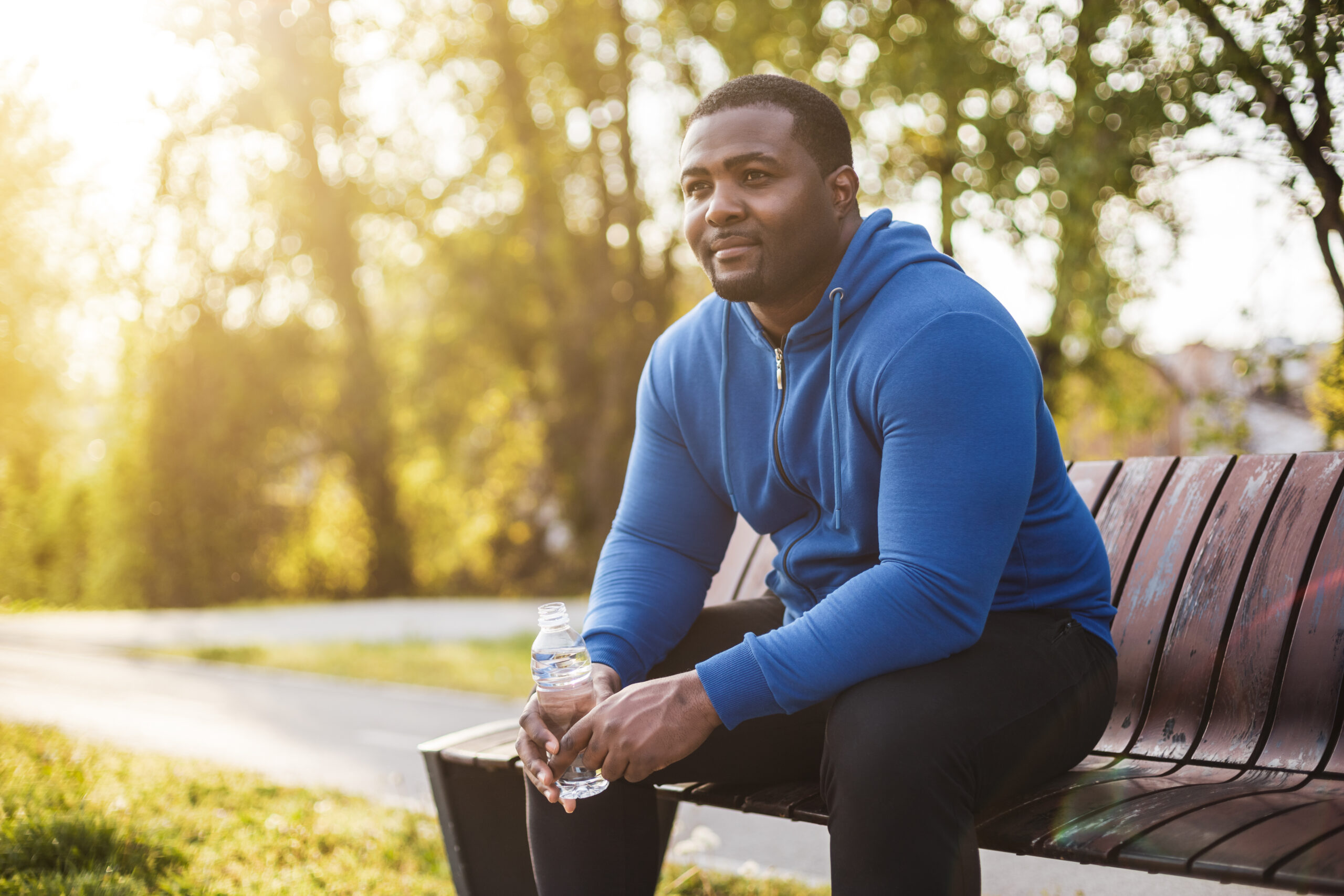 Man resting h after exercise and drinking water - Peak Health